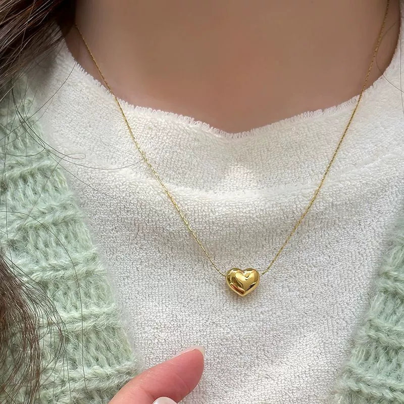 Petit Cœur Necklace — fine chain heart necklace angle | THE ARCIVE