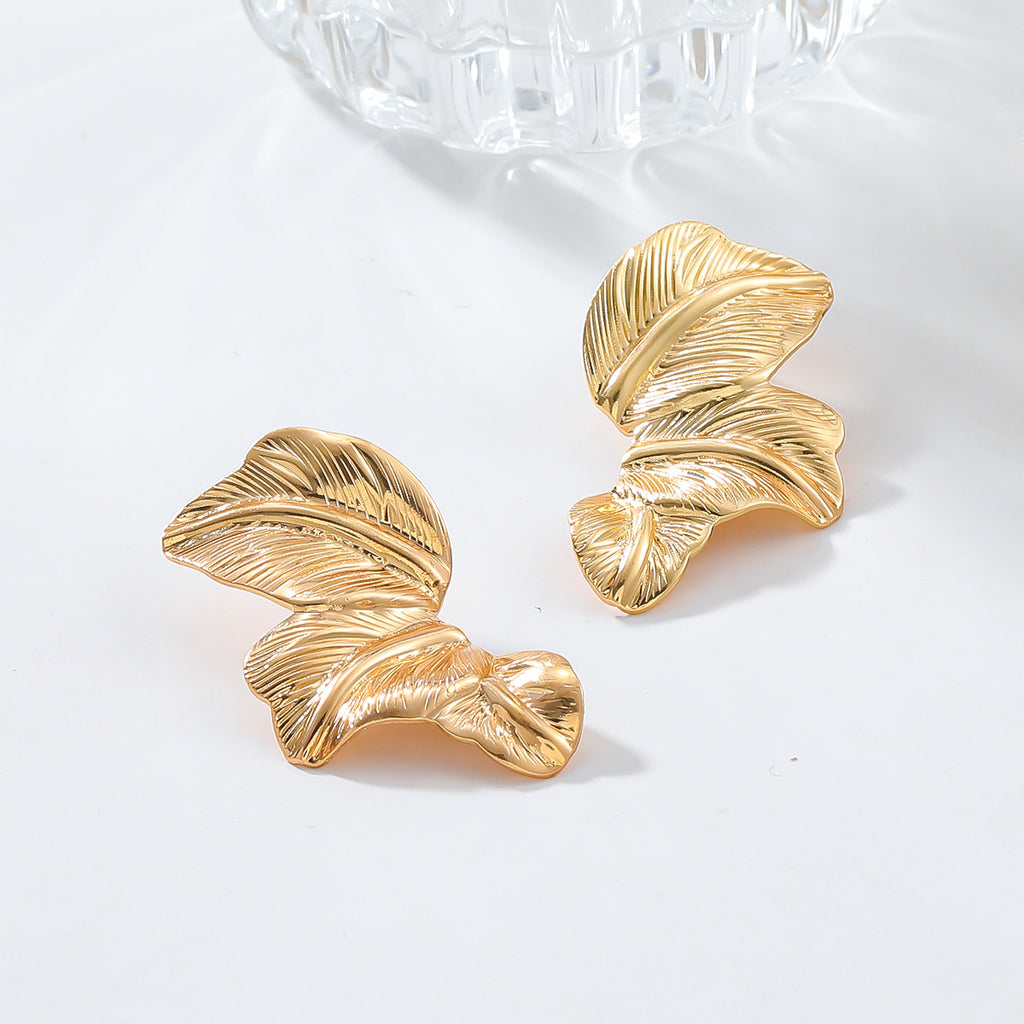 Papillon Studs — gold butterfly earrings angle | THE ARCIVE