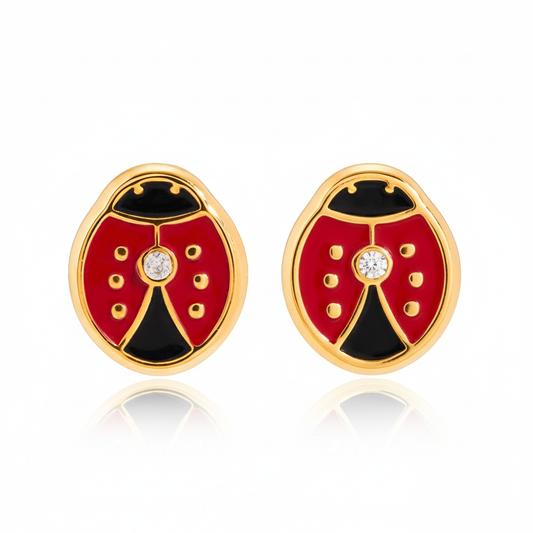 Pair of ladybug-shaped earrings with red, black, and gold colors on a white background.