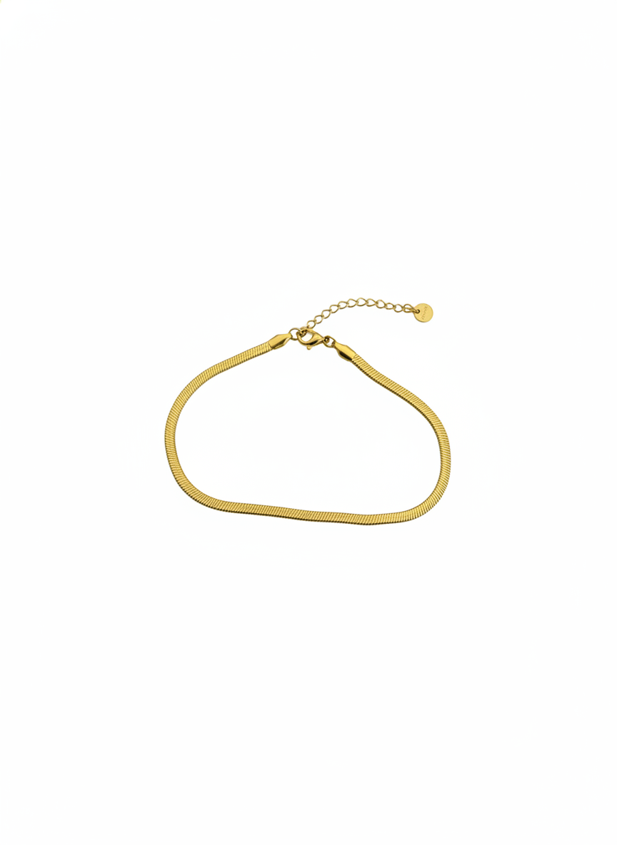 Serpent Anklet — minimalist gold anklet flat lay | THE ARCIVE