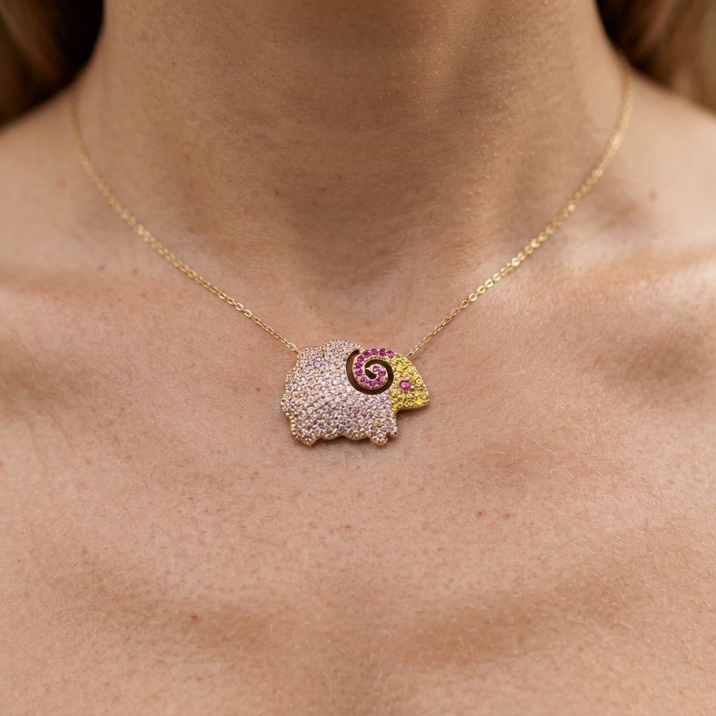 The Aries Studs, pink pavé ram stud earrings, worn on model | THE ARCIVE