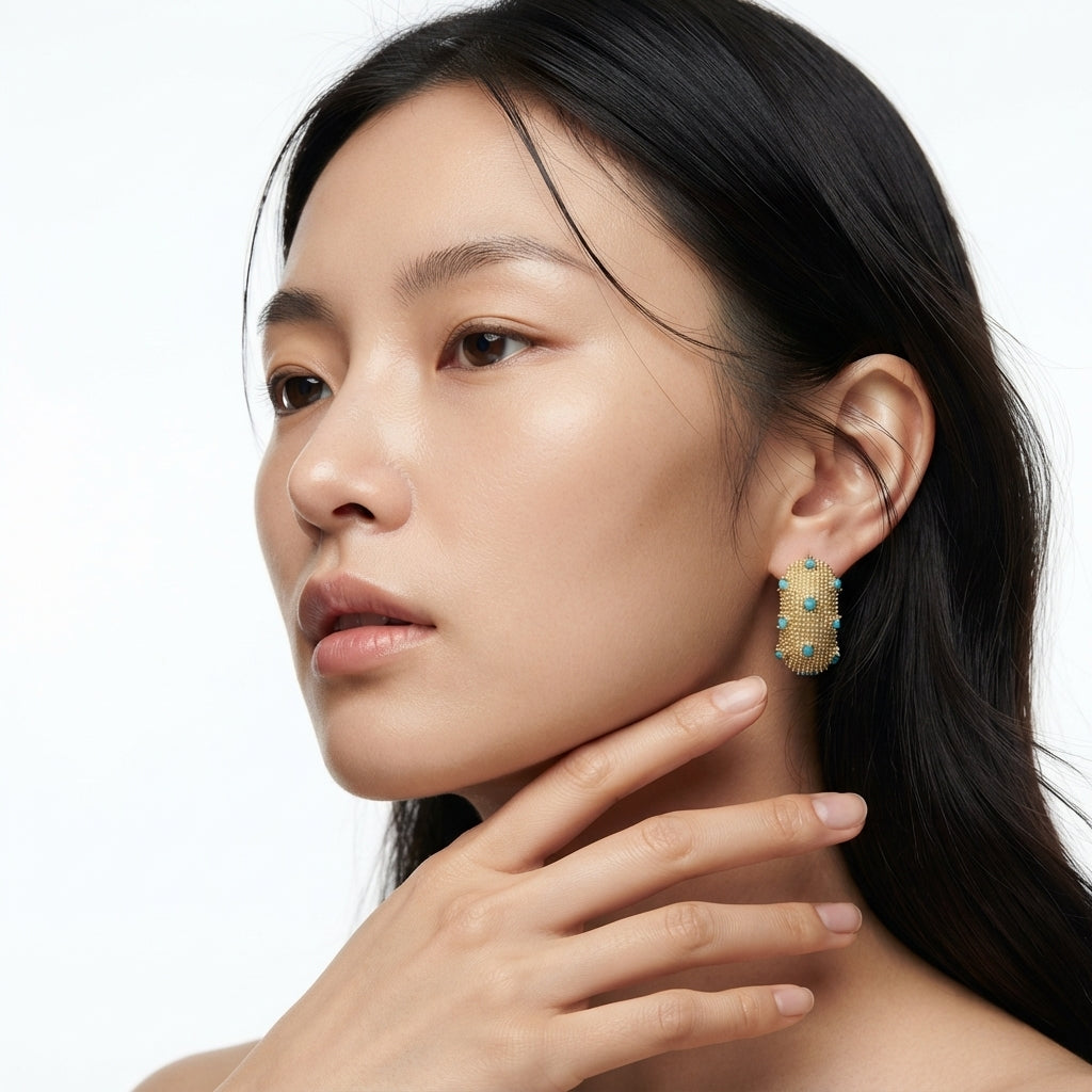The Caviar Huggies, beaded gold turquoise huggie earrings, worn on model three-quarter view | THE ARCIVE