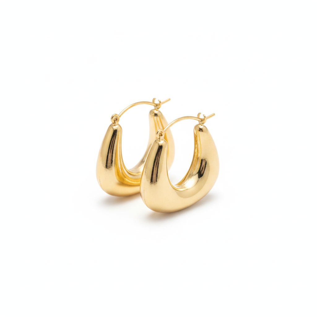 The Crescent Hoops, chunky gold crescent hoop earrings, angled view | THE ARCIVE