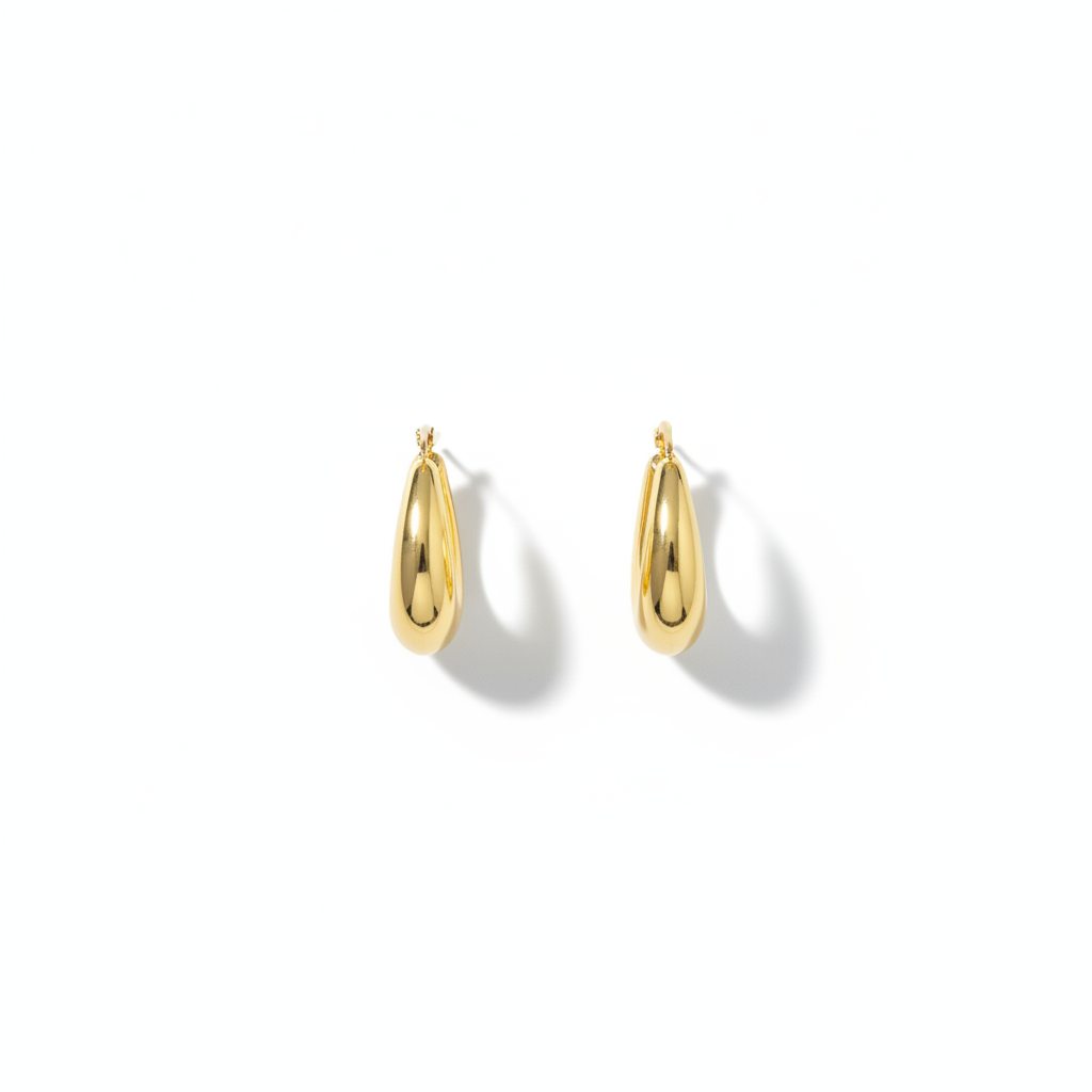 The Crescent Hoops, chunky gold crescent hoop earrings, flat lay view | THE ARCIVE
