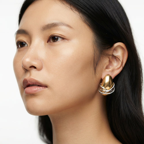 The Entwine Studs, two-tone wrapped dome earrings, worn on model | THE ARCIVE
