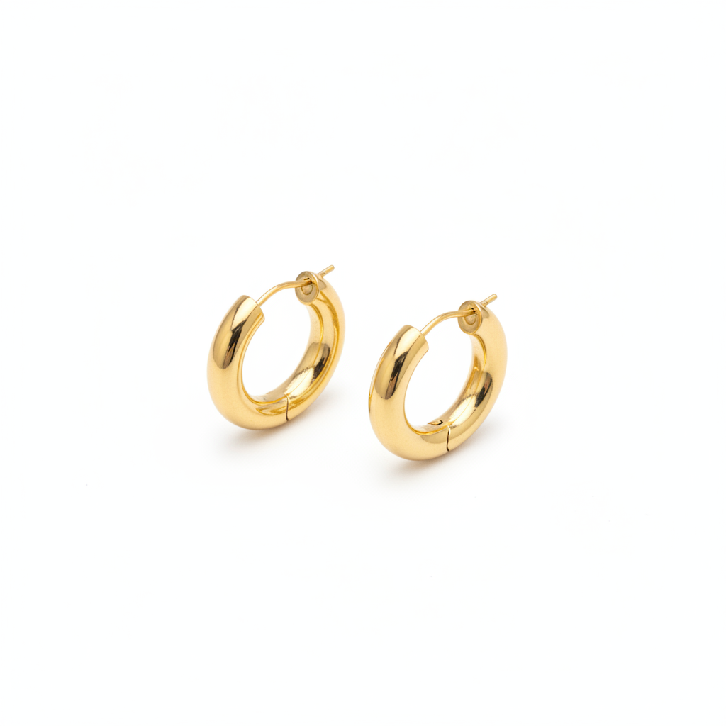 The Gilt Huggies, chunky gold huggie hoop earrings, angled view | THE ARCIVE