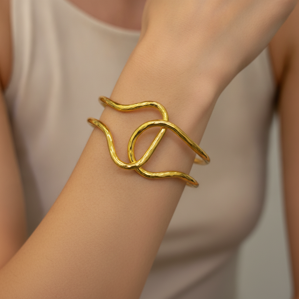 The Lasso Cuff, gold-tone wire knot cuff, worn on model | THE ARCIVE