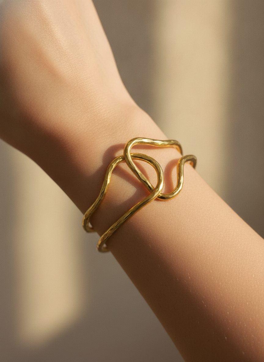 The Lasso Cuff, gold-tone wire knot cuff, worn on model | THE ARCIVE