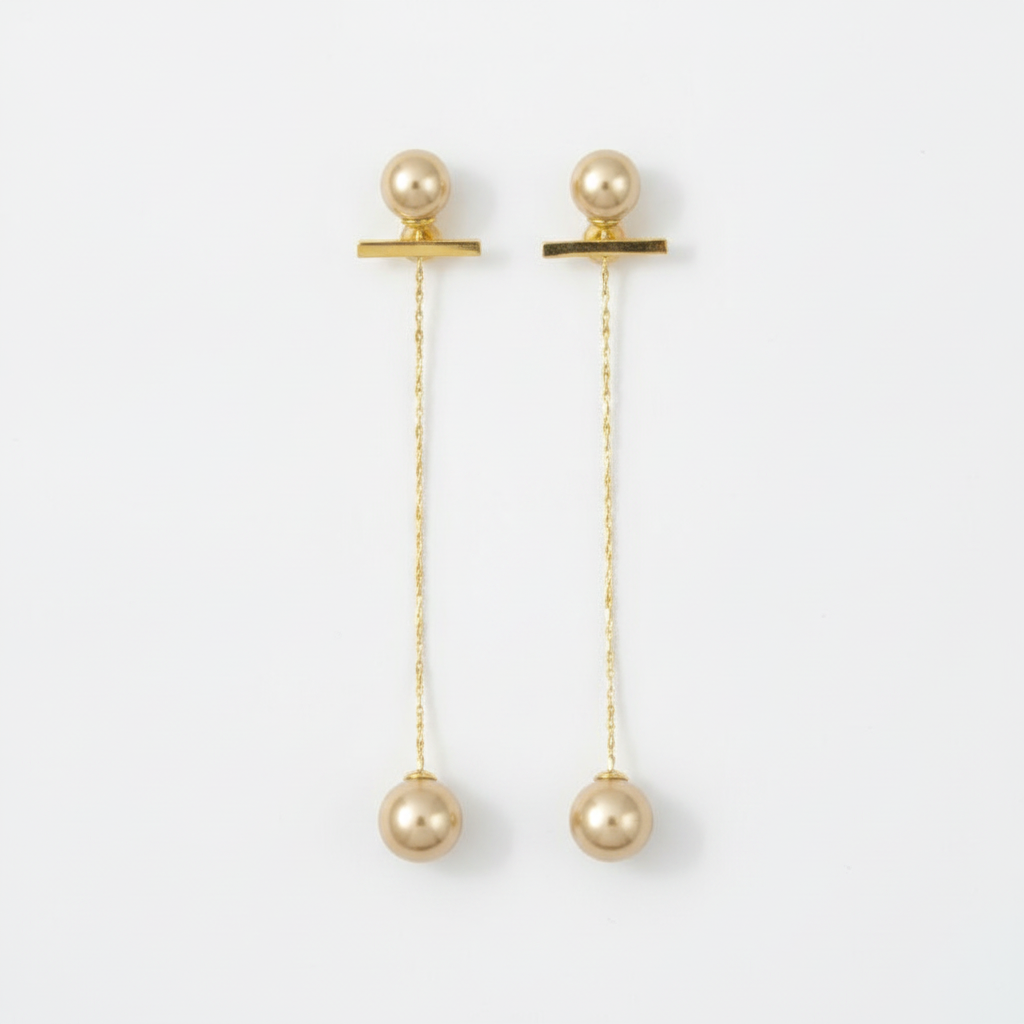 The Pearl Threaders, gold bar pearl threader earrings, flat lay view | THE ARCIVE