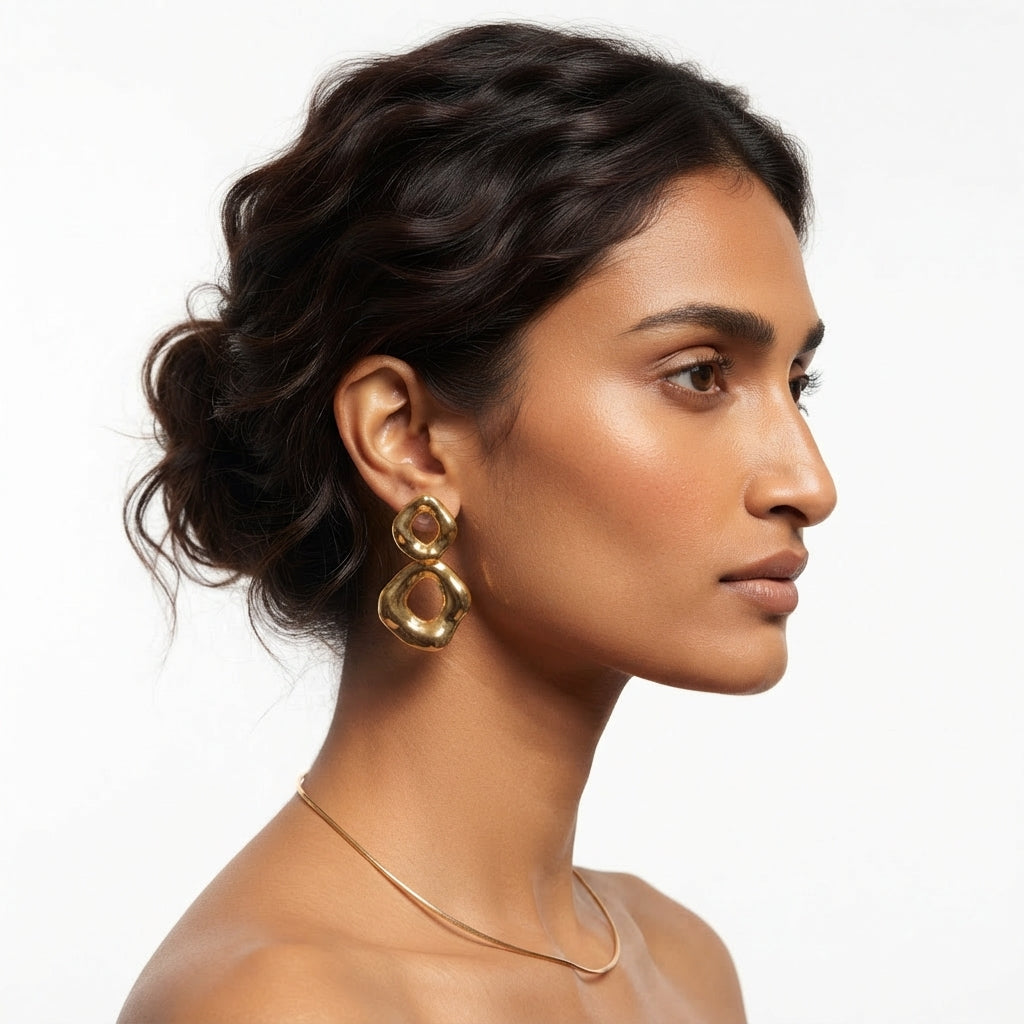 The Ripple Drops, organic gold double ring drop earrings, worn on model three-quarter view | THE ARCIVE