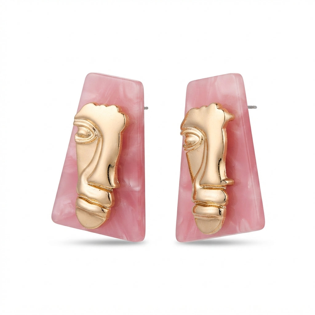 The Visage Studs, gold face and pink marble statement earrings, angled view | THE ARCIVE